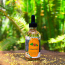 Kitty Karma Studio: Osmanthus oil in round dropper bottle outdoors