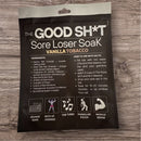 The Good Sh*t: Sore Loser Soak pouch on wooden background